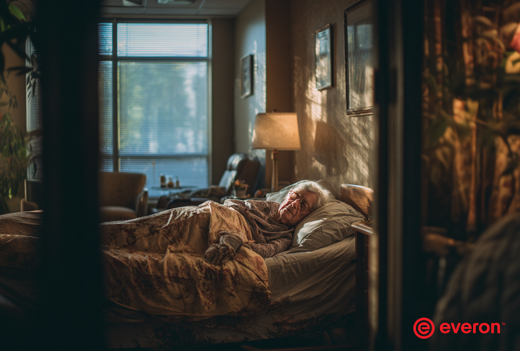 Elderly man sleeping in a bed